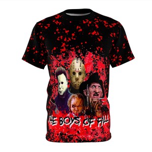 May include: Black t-shirt with a red splatter design. The shirt features a graphic of horror movie characters, including Michael Myers, Jason Voorhees, Freddy Krueger, and Chucky. The text "THE BOYS OF FALL" is printed in white.