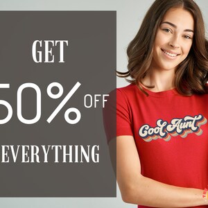 May include: A red t-shirt with the text "Cool Aunt" in a retro rainbow font. The text is in a white rectangle with a gray background. The text "GET 50% OFF EVERYTHING" is in white on a gray background.