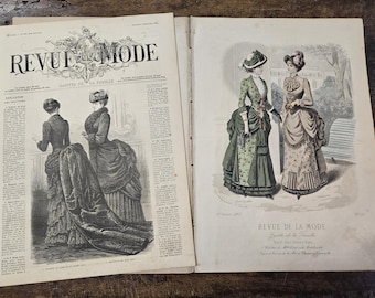 May include: A vintage fashion magazine cover featuring illustrations of women in elaborate dresses. The magazine is titled "Revue de la Mode" and is dated November 1886.