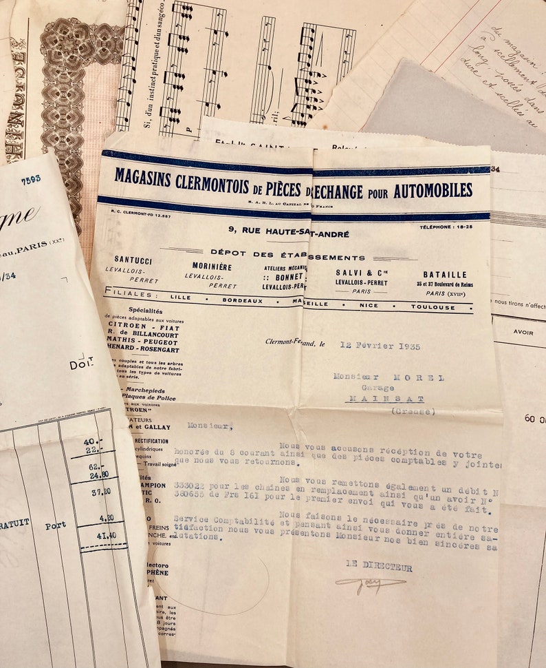 May include: A black and white document with the text "Magasins Clermontois de Pieces Dechange Pour Automobiles" and "9, Rue Haute-Saint-Andre". The document is dated "12 Fevrier 1935" and includes the name "Monsieur Horsl Garage Hainbat".