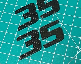VW Golf GTI Wolfsburg Edition 35-page emblem set in real carbon fiber