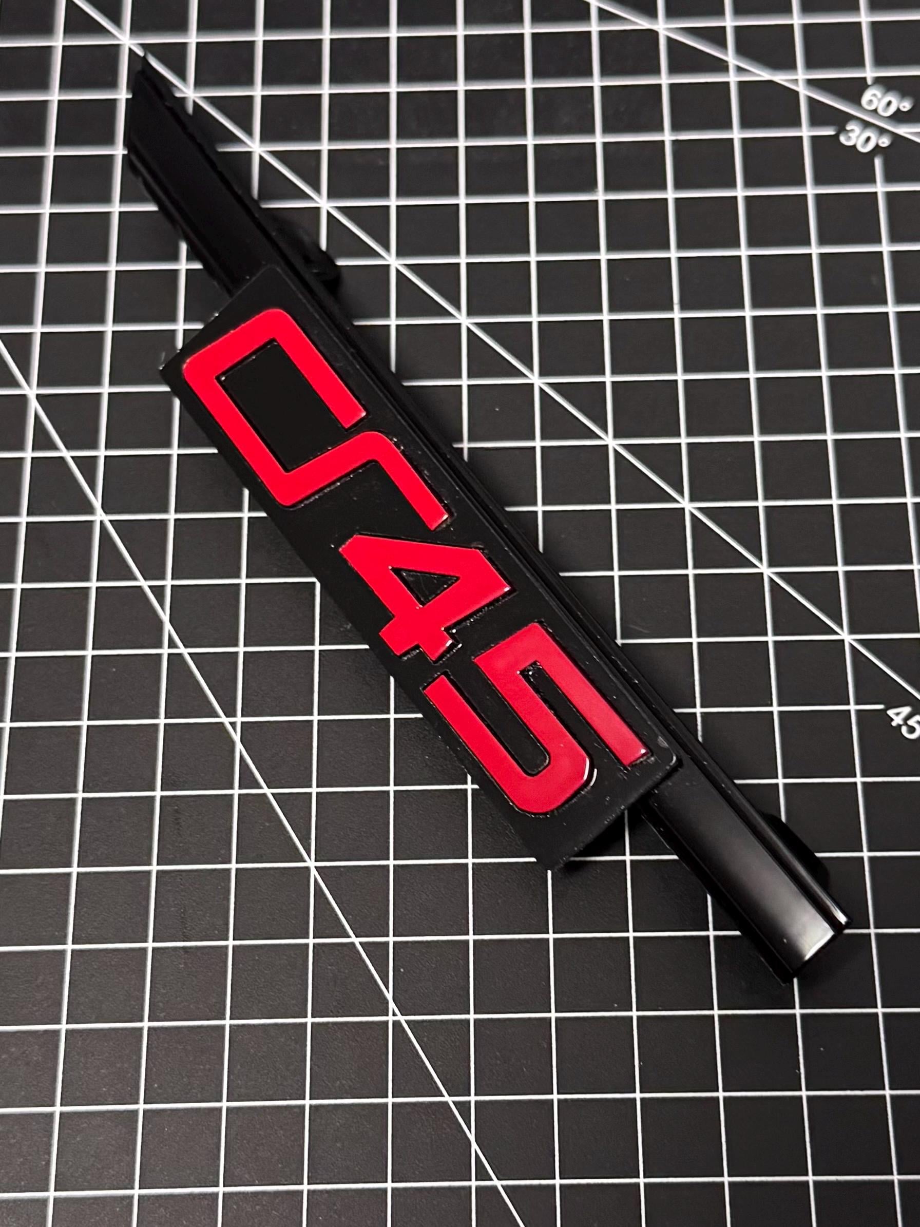 VW Golf 8 GTI Clubsport 45 grille emblem Tornado Red in new design