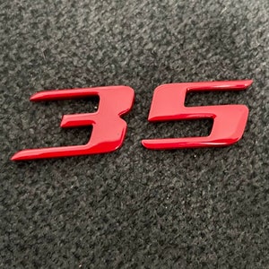 VW Golf GTI Wolfsburg Edition 35 emblem in tornado red