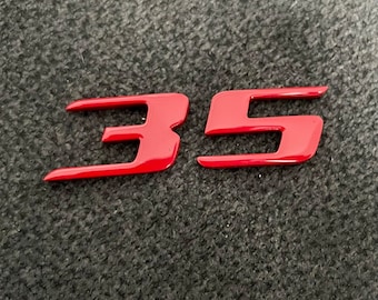 VW Golf GTI Wolfsburg Edition 35 emblem in tornado red