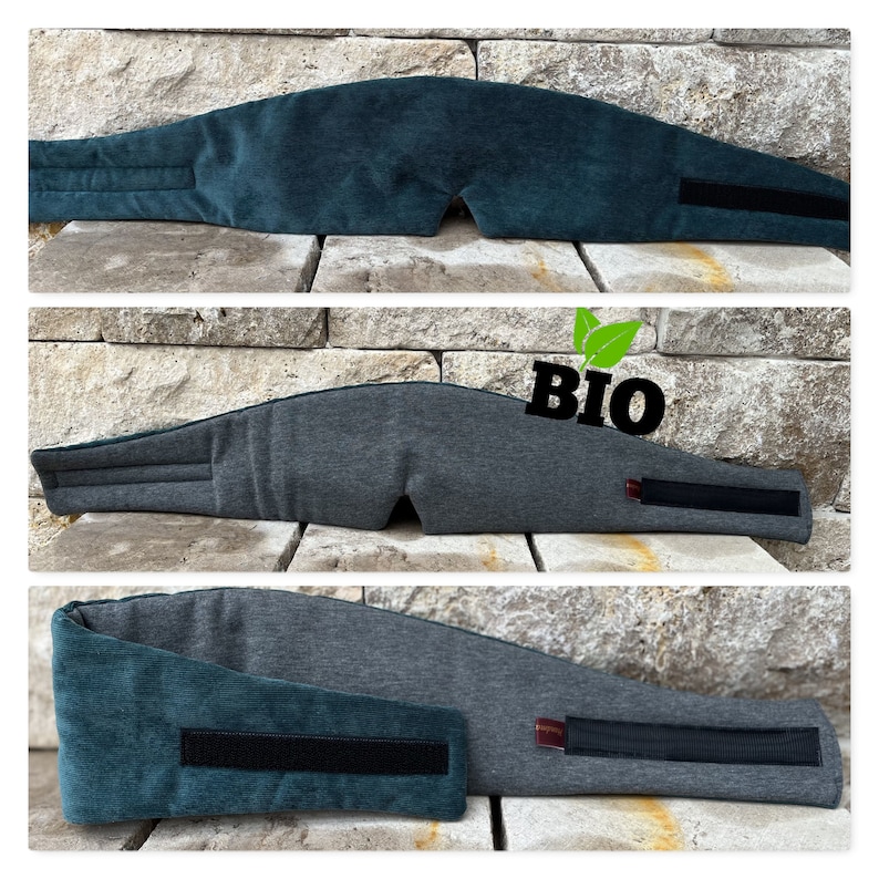 May include: Three sleep masks in shades of teal and gray, each with a curved design to fit the face. The masks have a Velcro strap for adjustable sizing. The word "BIO" is printed on one of the masks.