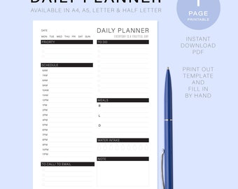 May include: A white daily planner with a blue pen. The planner includes sections for priority, schedule, to-do list, meals, water intake, and notes. Text on the planner reads "DAILY PLANNER" and "EVERYDAY IS A FRUITFUL DAY."