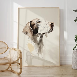 May include: A framed watercolor print of a dog's head and shoulders, in shades of brown, white, and gray. The dog is looking up, with a focused expression. The artwork is set against a cream-colored background.
