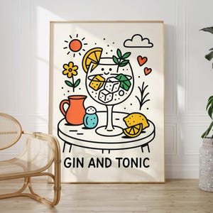 May include: A framed art print featuring a whimsical illustration of a gin and tonic cocktail. The artwork includes a large cocktail glass with ice cubes, a lemon slice, and the words "GIN AND TONIC" at the bottom. Other elements include a sun, flower, and hearts.