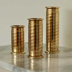 Trio of Mid-Century Swedish Brass Candle Holders