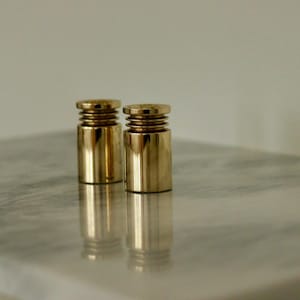 Pair of Mid-Century Swedish Brass Candle Holders