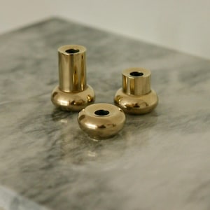 Trio of Mid-Century Swedish Brass Candle Holders
