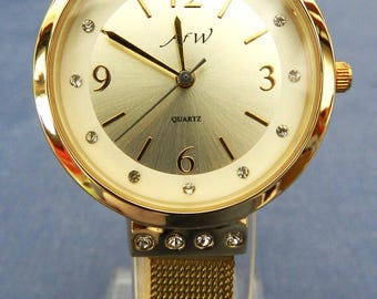 Aw ladies watch with crystals, gold-coloured, new