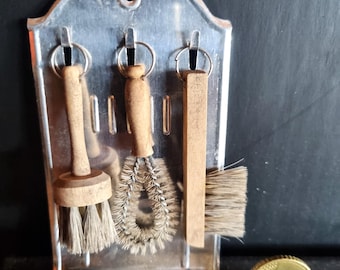 Old wall bracket with tin brushes, dollhouse shop