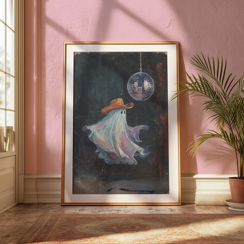 May include: A framed painting of a ghost wearing a cowboy hat and dancing under a disco ball.