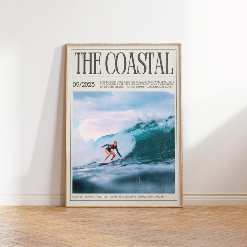 May include: Framed poster titled "THE COASTAL" with a surfing theme. The image features a surfer riding a large wave. The poster includes the date 09/2023 and text about surfing and autumn getaways.