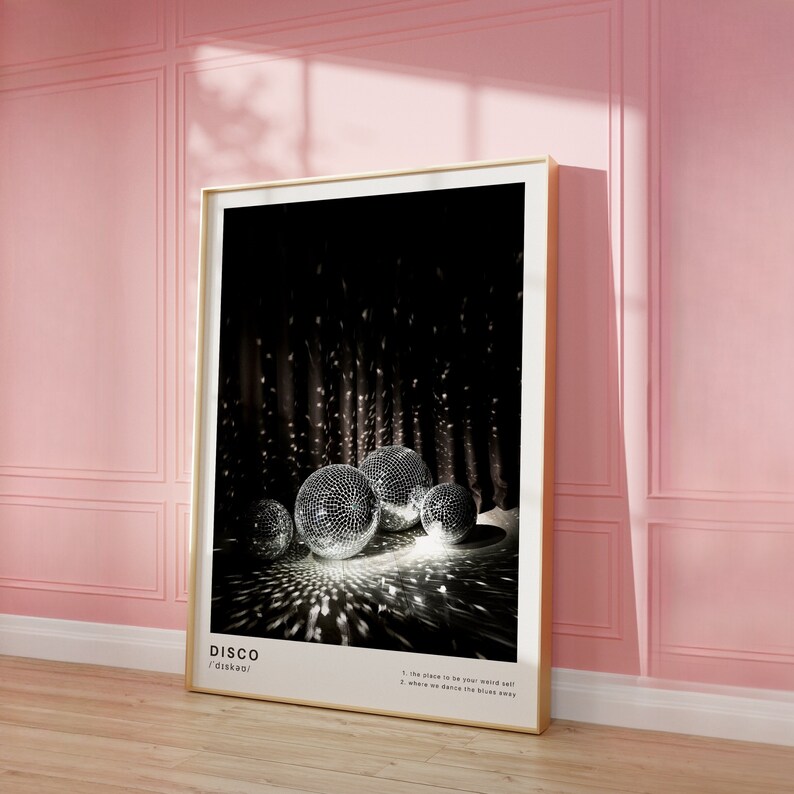 May include: A black and white poster with the word "DISCO" in large white letters. The poster features a group of disco balls reflecting light in a dark room. The text below the word "DISCO" reads "The place to be your weird self! Where we dance the blues away."