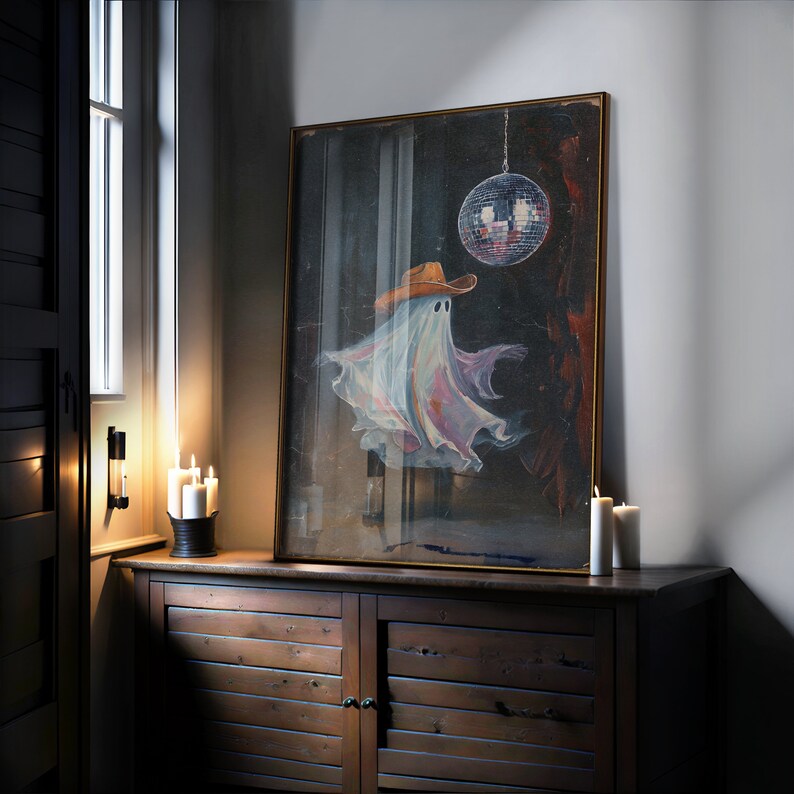 May include: A framed painting of a ghost wearing a cowboy hat and dancing in front of a disco ball.
