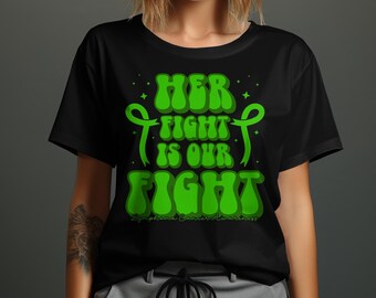 May include: Black t-shirt with a green graphic that says "Her Fight Is Our Fight" with a green ribbon design. The text is in a retro font style. The bottom of the graphic says "Lymphoma Cancer Awareness".