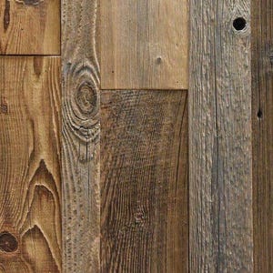 May include: A collection of vertical wooden planks featuring varied brown tones, prominent wood grain patterns, and natural knots. The surface displays a weathered texture with distinct vertical lines and a small circular hole in one board.