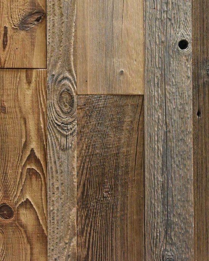 May include: A collection of vertical wooden planks featuring varied brown tones, prominent wood grain patterns, and natural knots. The surface displays a weathered texture with distinct vertical lines and a small circular hole in one board.