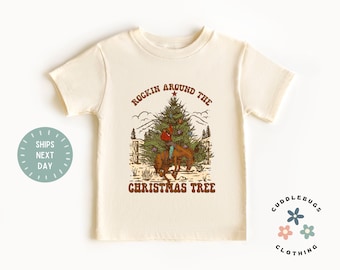 Rockin' Around The Western Cowboy Christmas Tree Toddler Shirt - Western Santa Holiday Kids Tee - Gift for Boy Girl - Natural Kids Tee