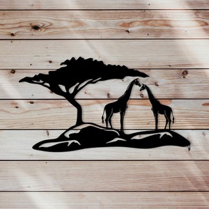 May include: Black metal silhouette wall art featuring two giraffes standing under a tree. The giraffes are facing each other and their necks are curved. The tree has a wide canopy and is set on a rocky base.