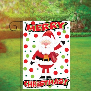 May include: A white Christmas garden flag with red and green polka dots. It features a cartoon Santa Claus waving with the words "Merry Christmas!" in red.