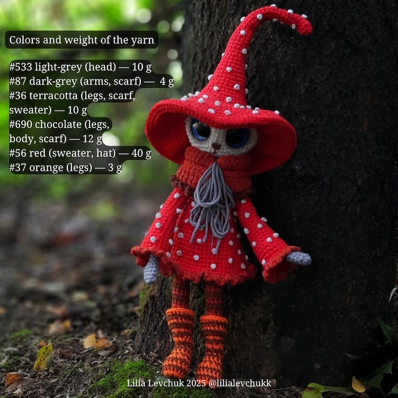 May include: A handmade crochet doll in a red mushroom outfit with white spots, a matching hat, and orange boots. The doll has light grey, dark grey, terracotta, chocolate, and orange yarn details. The doll is standing next to a tree.