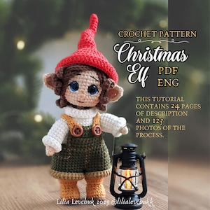 May include: A crocheted Christmas Elf doll wearing a red hat, white sweater, and green overalls. The doll has brown hair, large blue eyes, and tan ears. The image includes text that says "CROCHET PATTERN Christmas Elf PDF ENG". A black lantern is in the foreground.