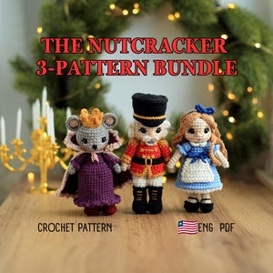 May include: Three crocheted dolls including a mouse in a purple cape and gold crown, a nutcracker soldier in a red uniform, and a girl in a blue dress. Text reads THE NUTCRACKER 3-PATTERN BUNDLE, CROCHET PATTERN, and ENG PDF with a flag icon.