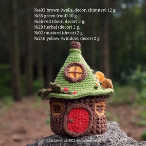 May include: A handcrafted crochet house with a brown base, a green roof, and a red door. The house features a round window and decorative elements in yellow and mustard. The text on the image reads: Lilia Levchuk 2025 @lilialevchukk.