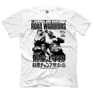 May include: Black and white graphic t-shirt featuring a wrestling match between The Animal and Hawk Hard, known as the Road Warriors. The text "超暴走軍団 極悪チャンプ・無法の嵐" is printed below the image. The text "licensed by pro wrestling tees" is printed below the Japanese text.