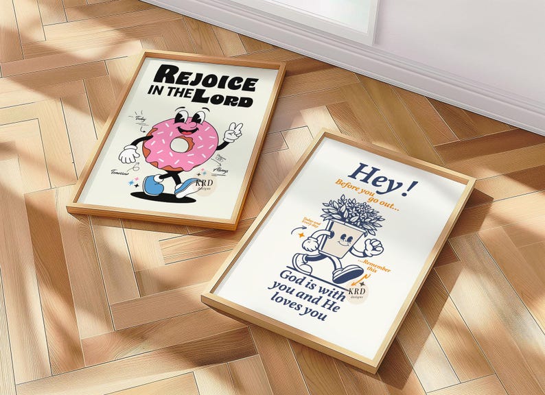 May include: Two framed illustrations with a religious theme. The first illustration features a pink and white doughnut with a smiling face and the text "Rejoice in the Lord". The second illustration features a potted plant with a smiling face and the text "Hey! Before you go out... God is with you and He loves you".