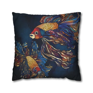 May include: Two colorful fish with gold scales and flowing fins on a dark blue background. The fish are stylized and have a graphic design aesthetic.