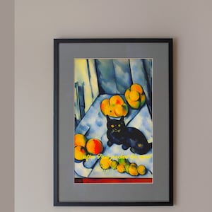 May include: A framed painting of a black cat sitting on a table with yellow and orange fruit. The painting is titled "After Paul Klee" and is signed "K. Schwitters".