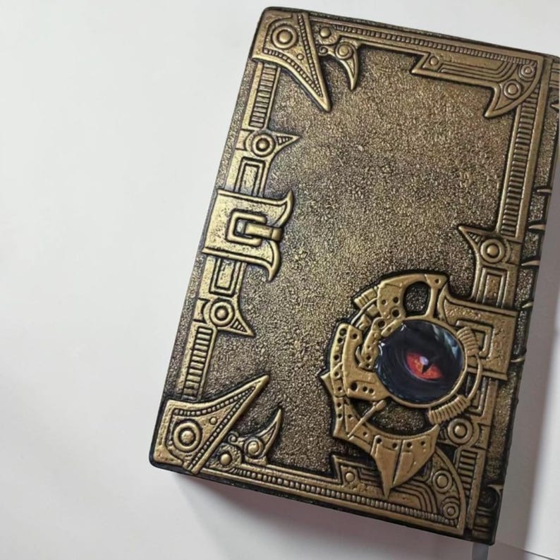 Dragon grimoire notebook, embossed dragon journal, fantasy notebook, dark academia journal, vegan leather notebook, DND journal, RPG notebook, gothic grimoire, medieval fantasy diary, dragon writing journal, mythical notebook, vintage fantasy journal, collectible fantasy notebook, magical writing diary, antique style notebook, fantasy worldbuilding journal, dragon aesthetic, enchanted notebook, roleplay notebook, writer gift, fantasy gift, gothic notebook, creative writing journal