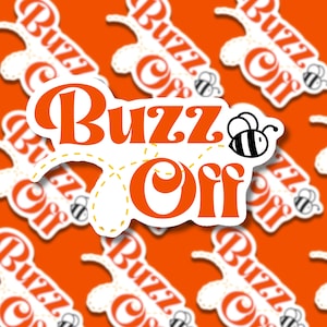 May include: Orange sticker with the words "Buzz Off" in a bold, retro font. A cartoon bee is next to the word "Off". The sticker has a white background with a yellow dotted outline and is set against a repeating orange background.