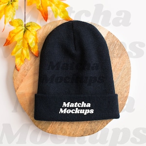 Yupoong 1501KC Cuffed Beanie Mockup, Styled Black Beanie Mockup with Fall Leaves