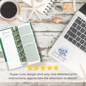 The pages are shown open in a Skinny Mini green binder gold silver rings. It is on a desk next to a laptop and a coffee cup. 5 yellow stars are shown with text from a customer review: Super cute design and very nice detailed print instructions!"