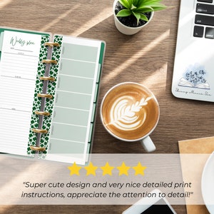 The pages are shown open in a Skinny Mini green binder gold silver rings. It is on a desk next to a laptop and a coffee cup. 5 yellow stars are shown with text from a customer review: Super cute design and very nice detailed print instructions!"