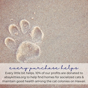This shop donates 10% of profits to abaykitties.org to help find homes for socialized cats and maintain good health among cat colonies on Hawaii. The photo is an image of an animal paw print in the sand.