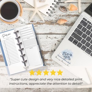 The pages are shown open in a Skinny Mini blue binder with silver rings. It is on a desk next to a laptop and a coffee cup. 5 yellow stars are shown with text from a customer review: Super cute design and very nice detailed print instructions!"