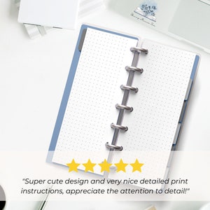 The pages are shown open in a Skinny Mini blue binder with silver rings. It is on a desk next to a laptop and a coffee cup. 5 yellow stars are shown with text from a customer review: Super cute design and very nice detailed print instructions!"