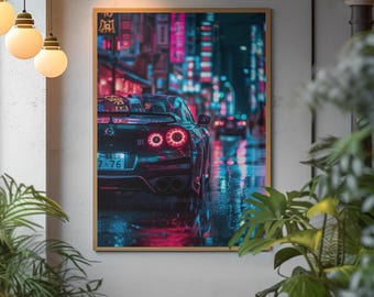 May include: Framed art print featuring a black sports car with illuminated taillights, parked on a wet street. The background shows neon lights and Japanese text, creating a vibrant, urban scene. The artwork is displayed in a gold frame.