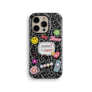 May include: Black phone case with a notebook paper design and colorful stickers. The stickers include a smiley face, a heart, a star, a cherry, a phone, and the words "Dream", "Super", "Cool", and "Custom".