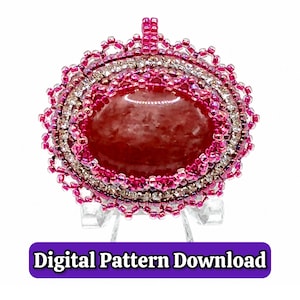 May include: An oval pendant featuring a large, smooth, reddish-pink cabochon stone at the center, surrounded by concentric layers of small, sparkling clear crystals and vibrant pink seed beads. The text Digital Pattern Download is below.