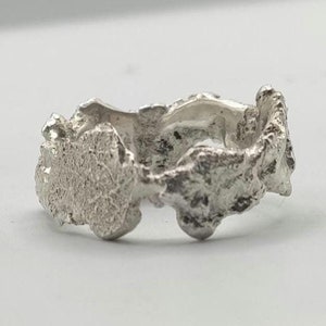 Brutalist organic molten silver ring band