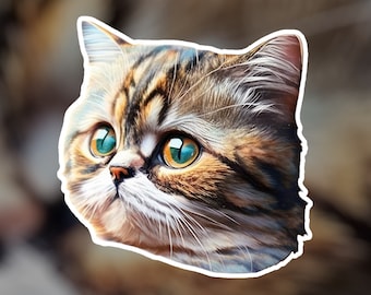 May include: A close-up of a brown tabby cat with green eyes. The cat is looking to the left of the frame. The cat's fur is soft and fluffy.