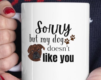 May include: White ceramic mug with a brown dog illustration and the text "Sorry but my dog doesn't like you" printed in black.
