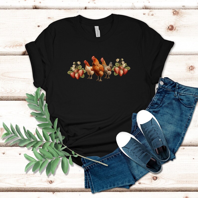 May include: Black t-shirt with a graphic of three chickens and strawberries. The chickens are brown and white with red combs. The strawberries are red and green.